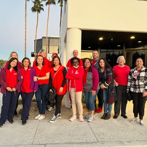 Large group of smiling nurses outside Desert Regional Medical Center