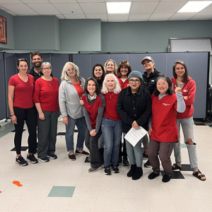 Large group of nurses inside hospital, smiling