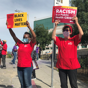 Nurses hold signs "Black Lives Matter"