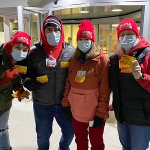 Group of nurses outside hospital wearing MSNA hats