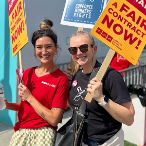 Two nurses on picket line smiling