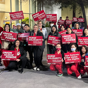 Contra Costa nurses with signs: "Union nurse power" "Nurse solidarity builds strong communities" "Union nurses build healthy communities" "Our patients our union our rights""