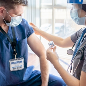 Nurse receiving vaccination