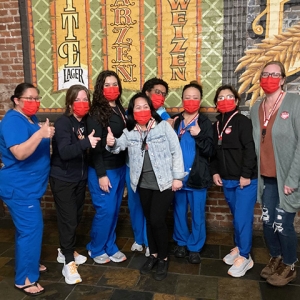 Group of nurses giving thumbs up