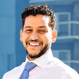 Headshot of Junaid Ahmed smiling