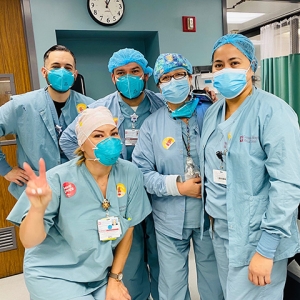 Group of five nurses inside hospital