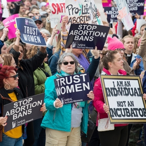 Large group of people holding Stop Abortion Bans Rally in St. Paul, Minnesota