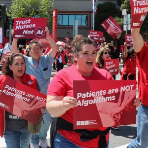 Nurses holding signs that read "Patients are not algorithms."