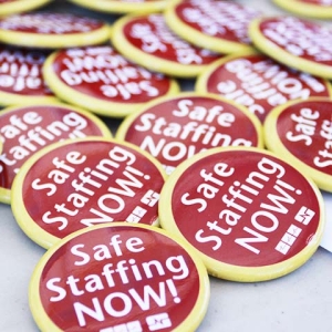 Pile of buttons that say "Safe Staffing Now!"