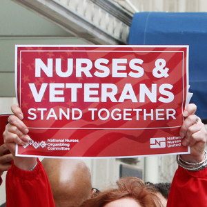 Sign "Nurses and Veterans stand together"