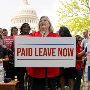 NNU President Jean Ross in front of podium