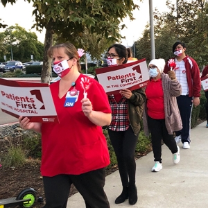 Verdugo Hills nurses picketing outside hospital with signs "Patients First"