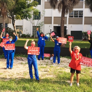 Nurses in Florida with signs "Save Lives: Safe Staffing Now"