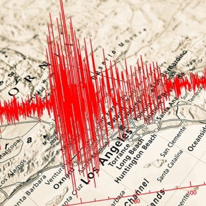 Seismograph overlaying map of California.