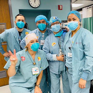 Group of masked nurses inside hospital