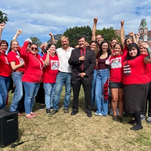 Nurses standing with Troy Jackson and Graham Platner, raised fists