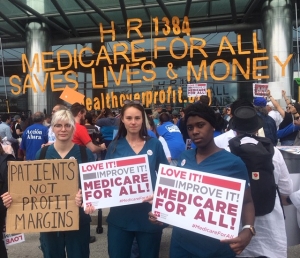 Nurses holding signs