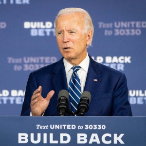 President Joe Biden in front of "Build Back Better" background