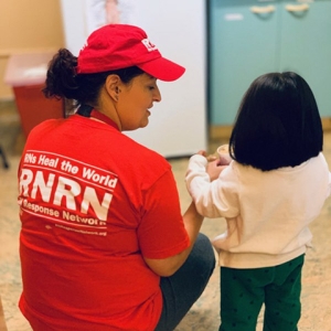 RNRN volunteer Jessica Rose provides care to a child