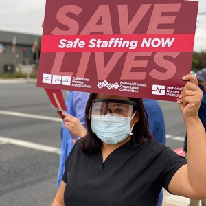 Nurse hold signs calling for safe staffing
