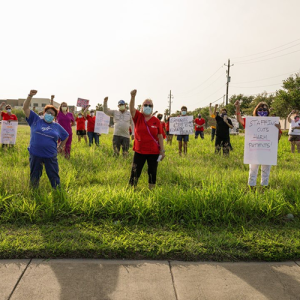 Nurses hold raised fists