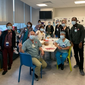 Palomar Health healthcare workers inside hospital wear stickers calling for safe staffing ratios