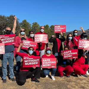 Group of nurses with raised fists