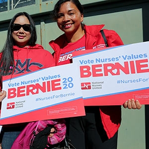 Nurses holding Vote Nurses' Values signs