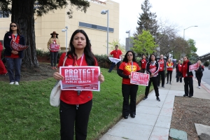 nurses holding signs