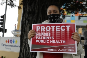 nurse holding sign