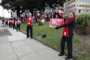 nurses holding signs