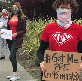 nurses holding signs