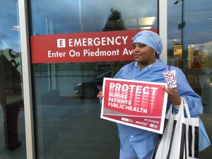 nurse holding sign