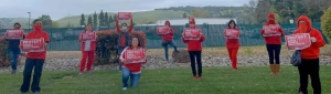 nurses holding signs