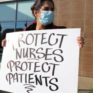 nurse holding sign