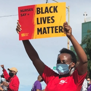 nurse holding sign