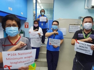 Filipino health workers in action for better wages and more protective equipment