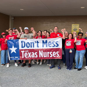 St. Jospeh's nurses hold banner that reads "Don't mess with Texas Nurses!"