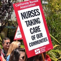 nurse holding sign