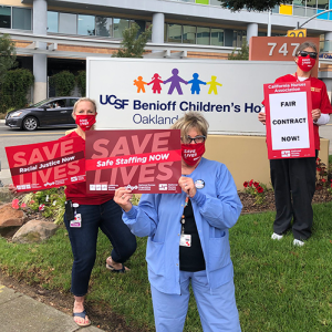 Nurses holds signs for safe staffing