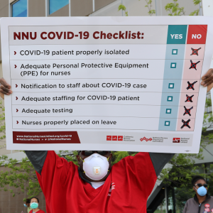 Nurse holds sign "NNU Covid-19 Checklist"