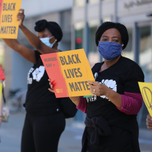 Nurses holding signs "Black Lives Matter"