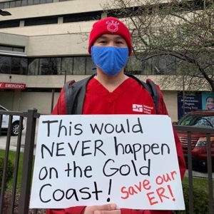 Nurses hold sign "Protect our ER"