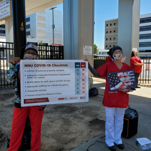 VA Nurses holding signs