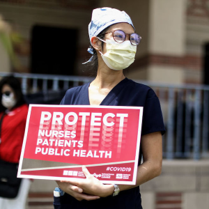 Nurses holding sign "Protect Nurses"