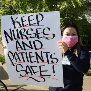nurse holding sign