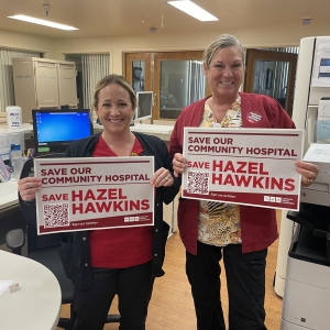 Nurses holding "Save Hazel Hawkins" signs