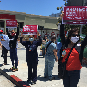 Nurses holds sign "Protect Nurses"