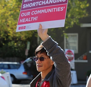 Health care workers with signs