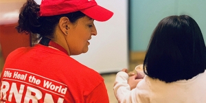 RNRN volunteer Jessica Rose provides care to a child at an Arizona Border Shelter